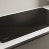 Detailopname Hoover HIFS954SC inductiekookplaat met sliderbediening en vijf kookzones