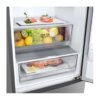 Close-up van Fresh Zone lade gevuld met fruit en Fresh Converter lade met zalm en citroen